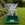 A green rectangular plastic planter tray, with a bag of compost and gardening tool.
