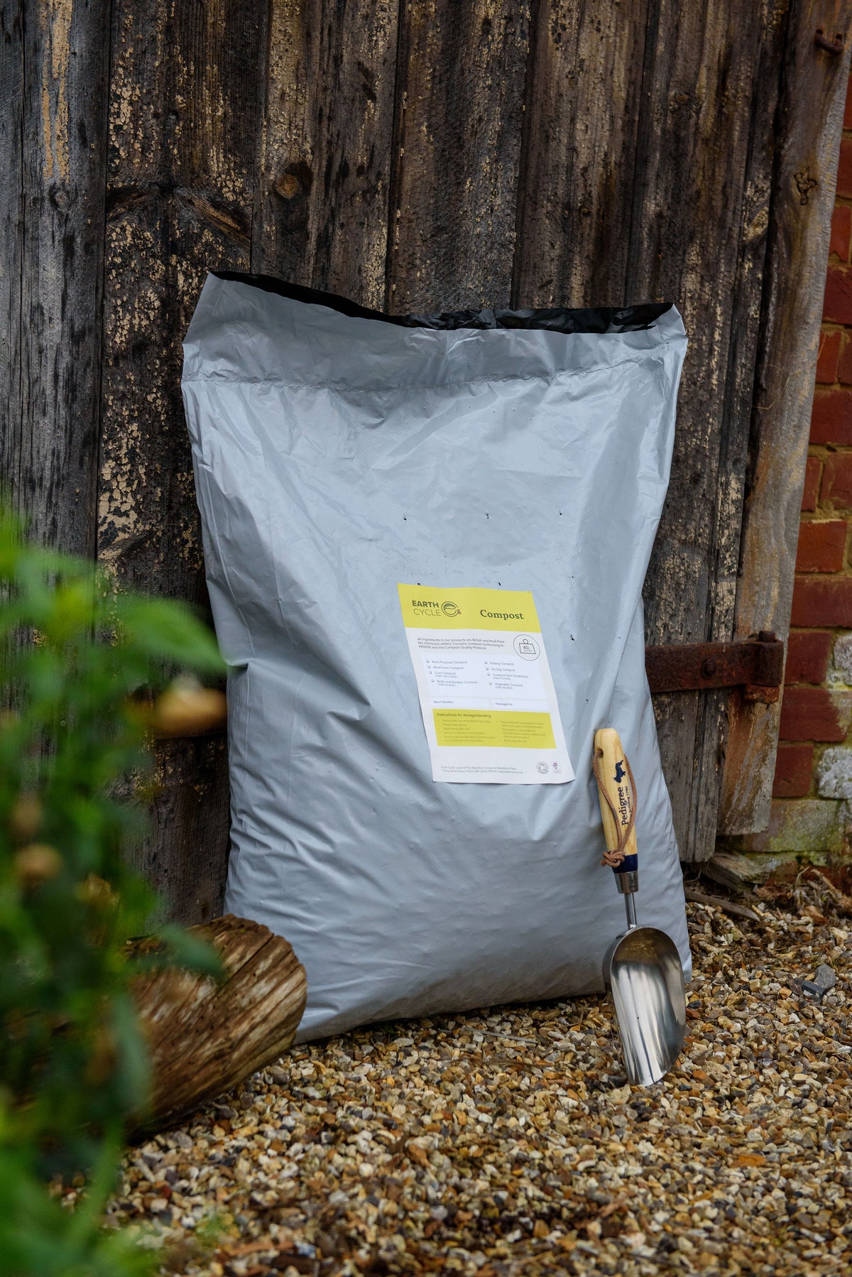 Small bag of compost with trowel to the side