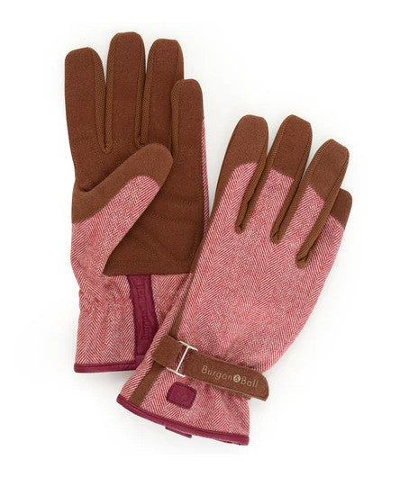 Pair of gloves with brown and pink pattern on a white background