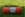Roll of red vegetable storage net with packaging on grass