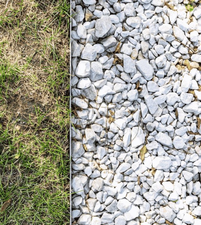 Blue slate stones covering the right two-thirds, with grass on the left third